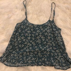 Teal tank top with a sweet daisy print and ruffle
